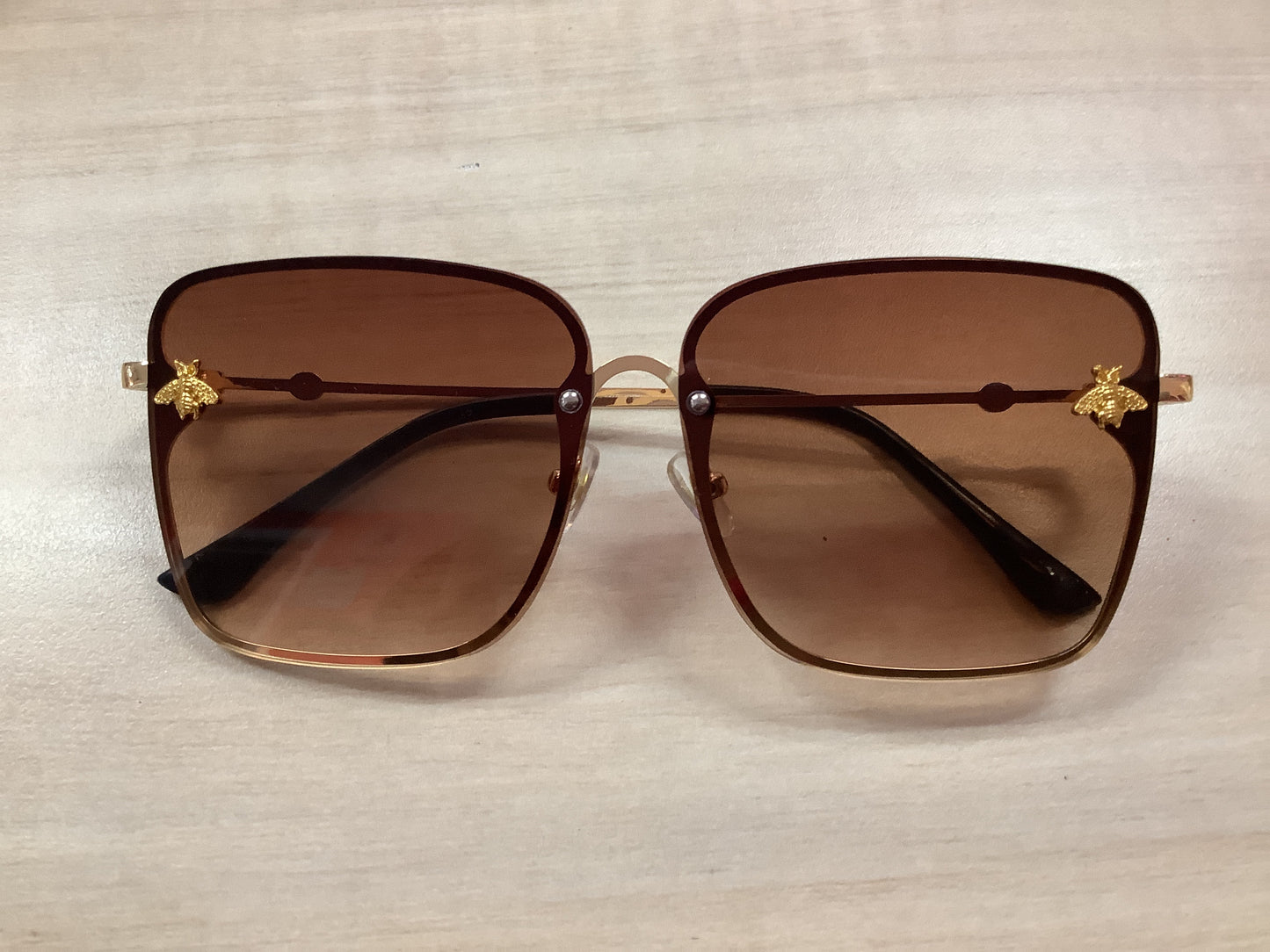 Sunglasses gold frame brown tint