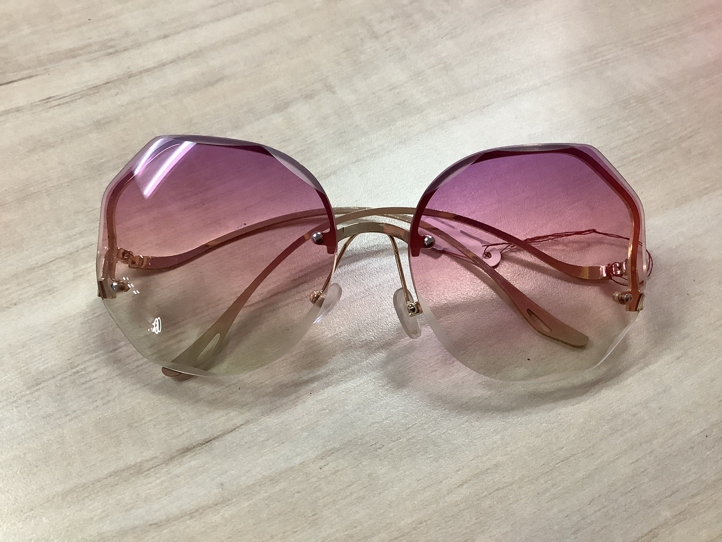 Sunglasses gold frame pink tint
